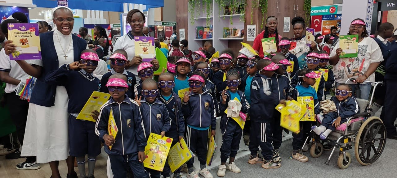 St. Scholastica learners exploring books during an educational visit