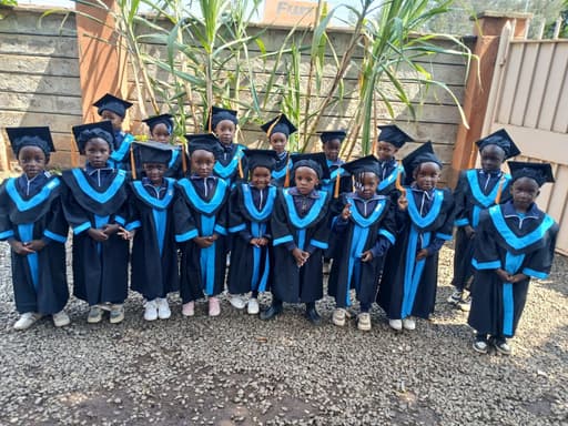 St. Scholastica children in graduation gowns